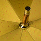 Light green umbrella with light pink dots and handle made of chestnut wood