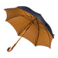 Blue umbrella with light brown dots and handle made of chestnut wood
